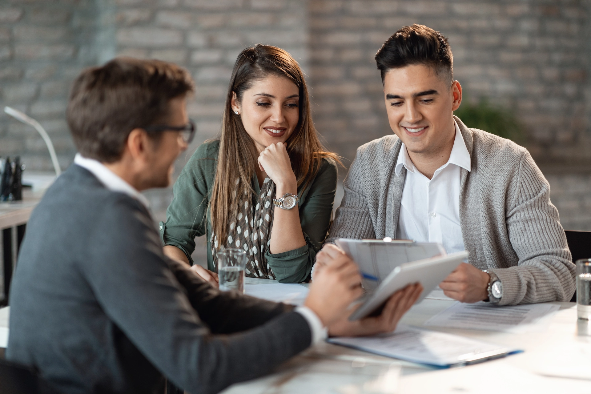 Young couple consulting with a bank manager about smsf lending options.