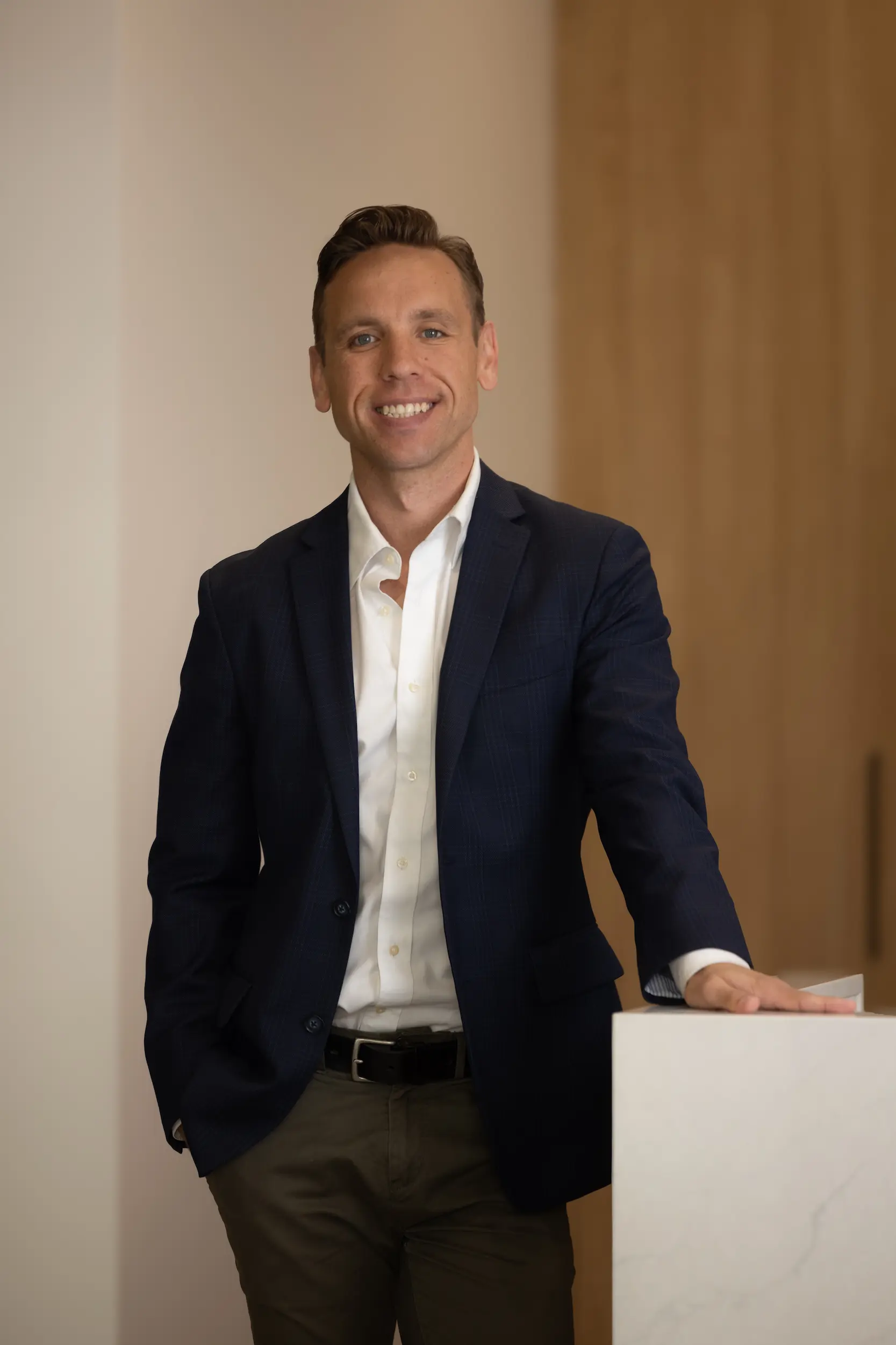 Troy Phillips, FirstPoint Mortgage Brokers managing partner, smiling confidently.