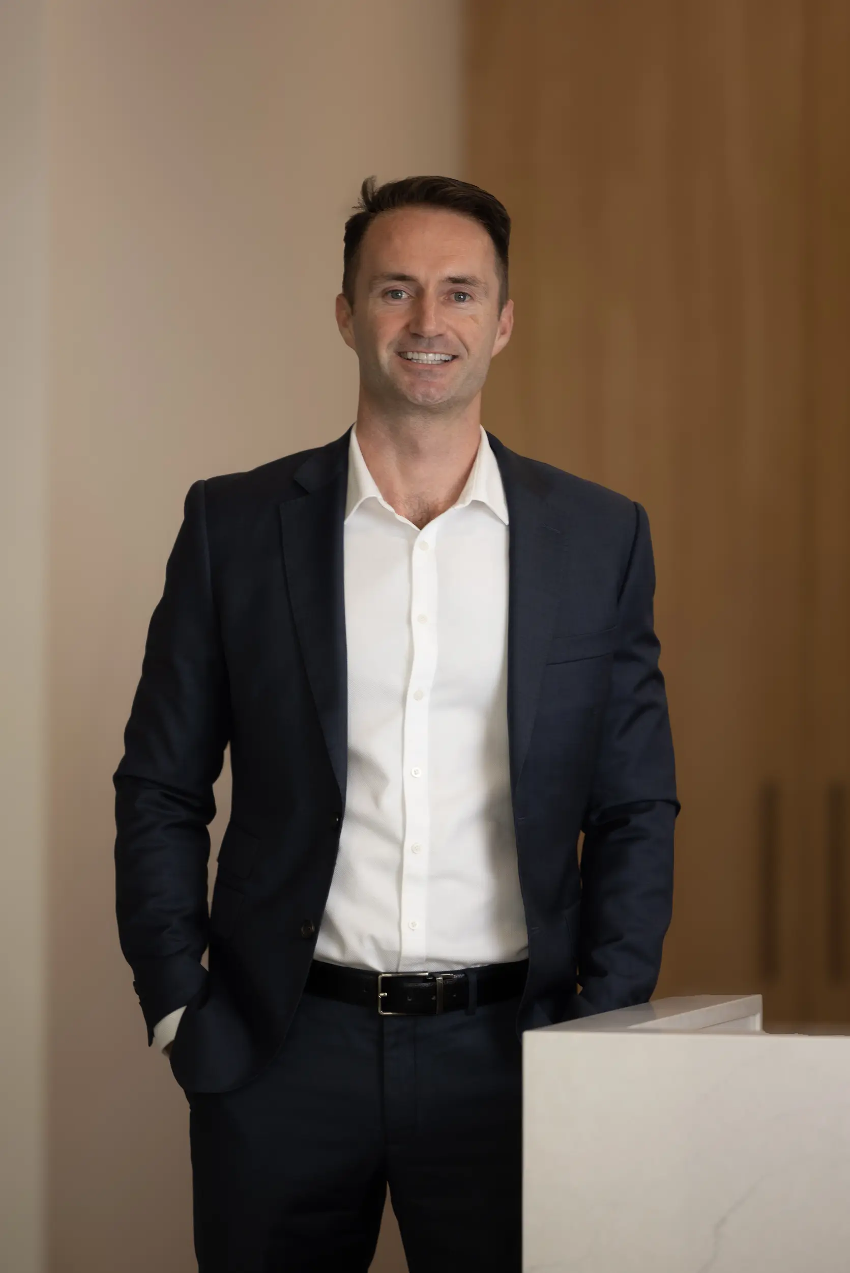 Christopher Pryer, FirstPoint Mortgage Brokers senior partner, in a professional suit.