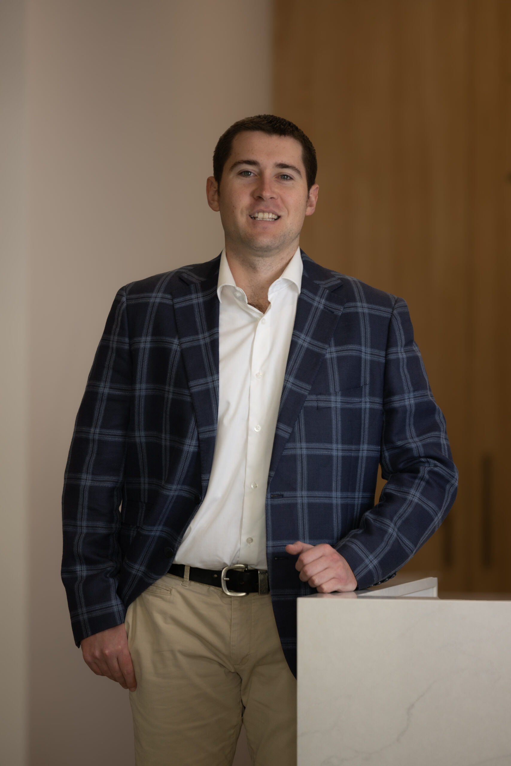 Jack Phillips, asset finance specialist at FirstPoint Mortgage Brokers, smiling professionally.