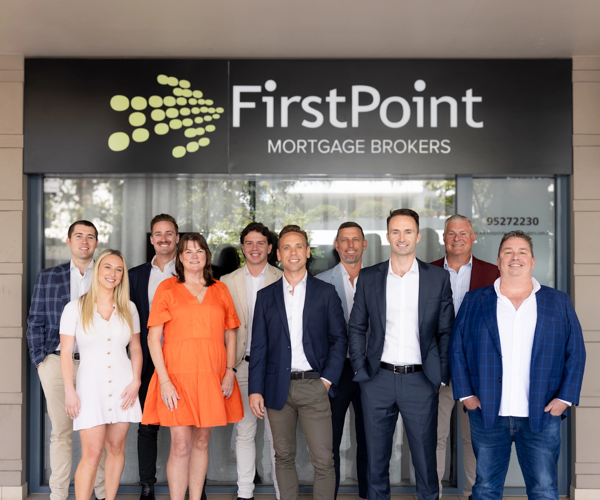 The FirstPoint Mortgage Brokers team in Cronulla, Australia, standing in front of their office.