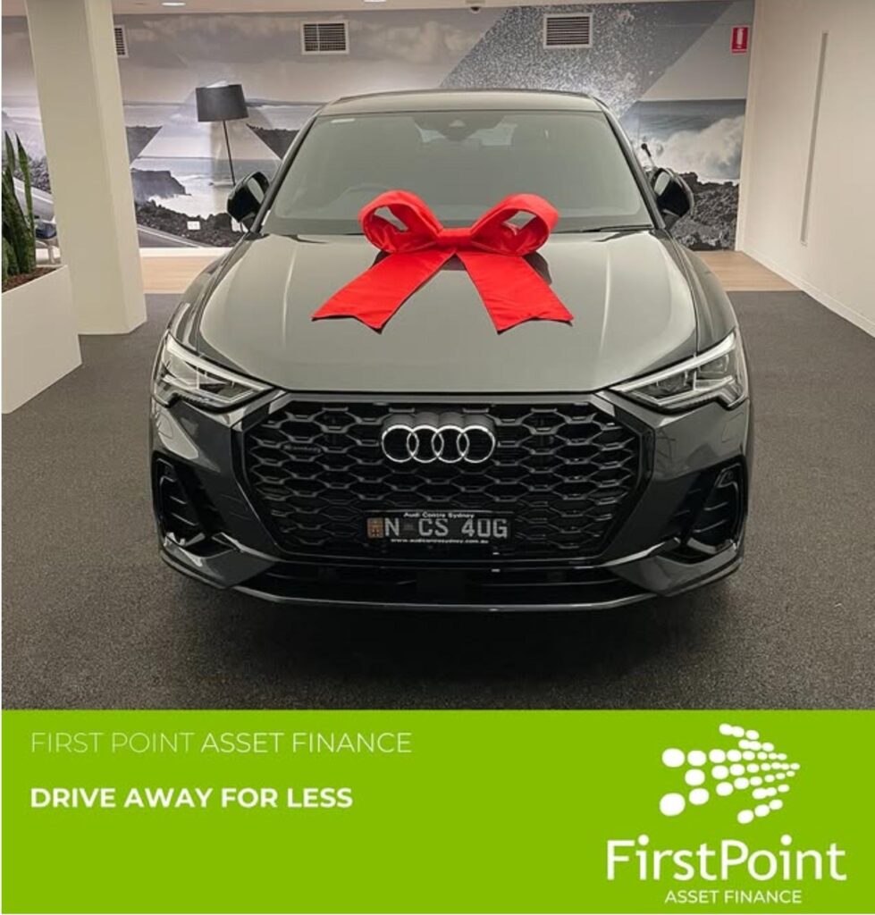 New Audi with a red bow, representing car loan approval from FirstPoint in Australia.