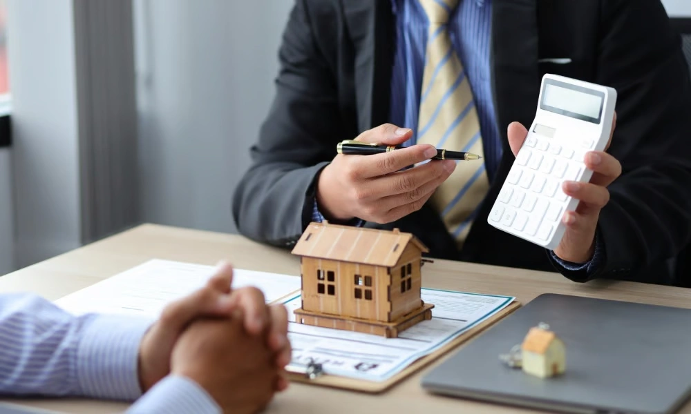Property investment mortgage broker discussing loan options with a client in Cronulla, Australia.