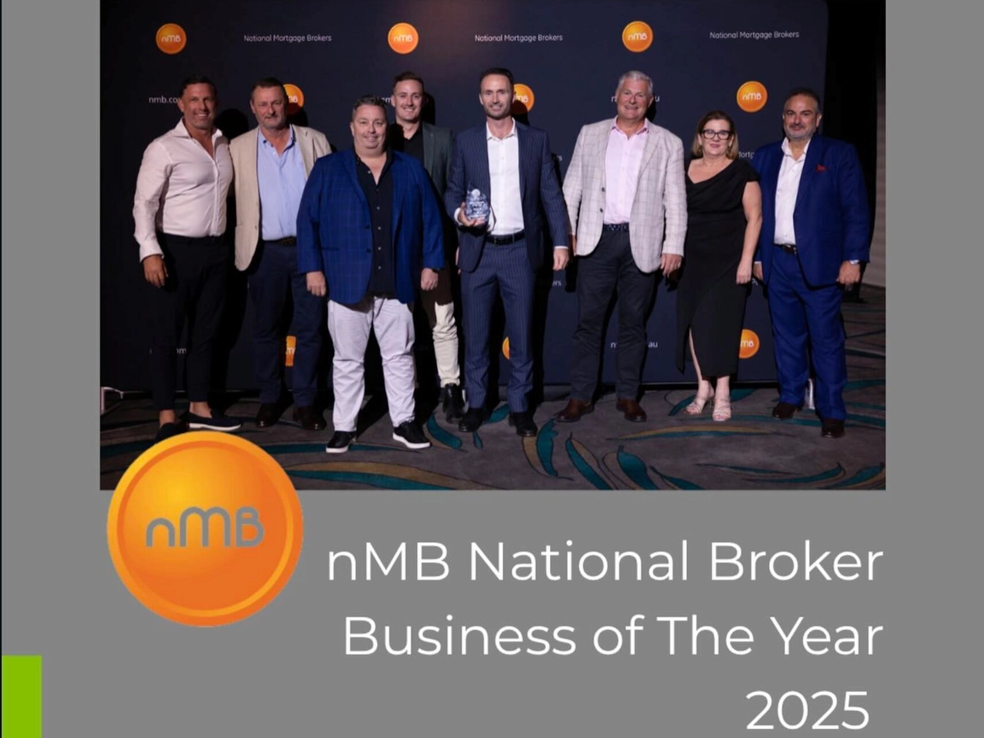 Group of brokers celebrating nmb national broker business of the year award in australia.